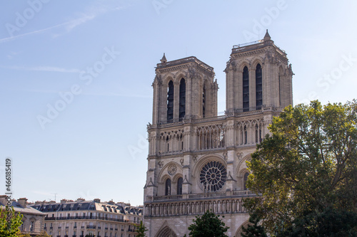 Cityscape view of the exterior stone architecture of the famous Notre Dame de Paris, including current reconstruction
