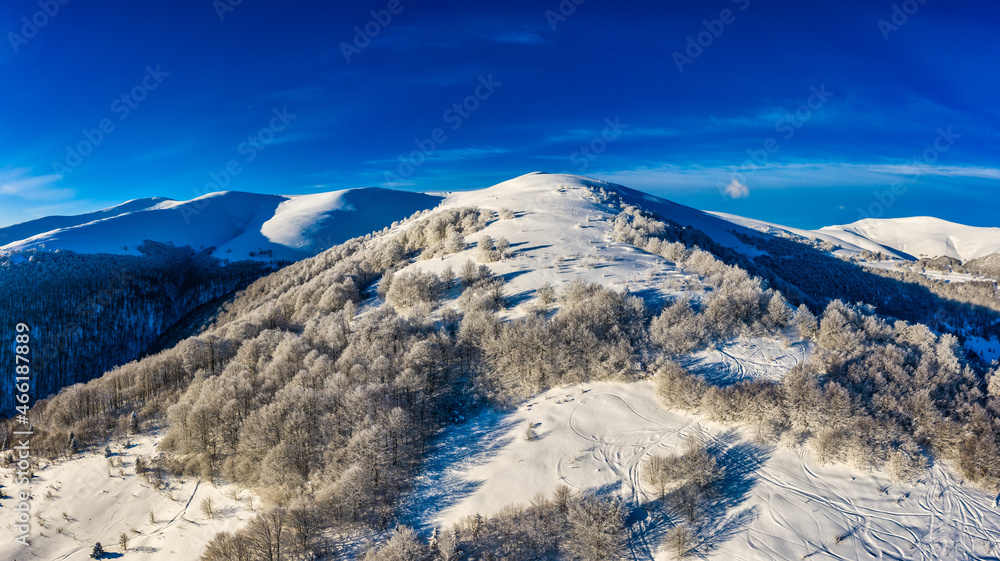 Aerial view of beautiful winter mountain slopes
