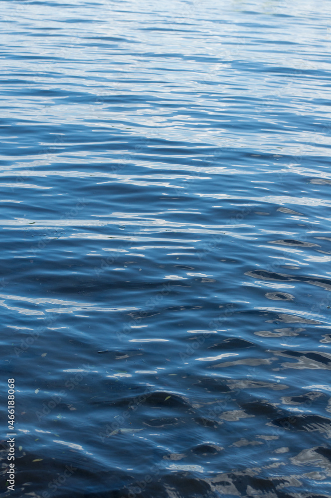 the texture of the water surface is a rich blue color in a vertical position the texture of the water surface is a rich blue color in a vertical position