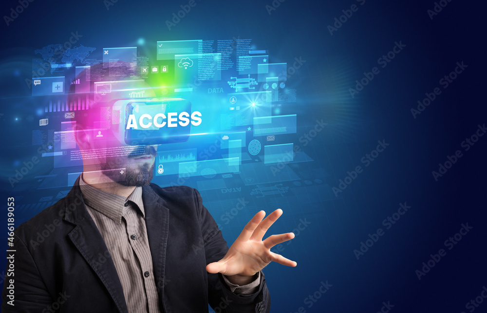 Businessman looking through Virtual Reality glasses Businessman looking through Virtual Reality glasses