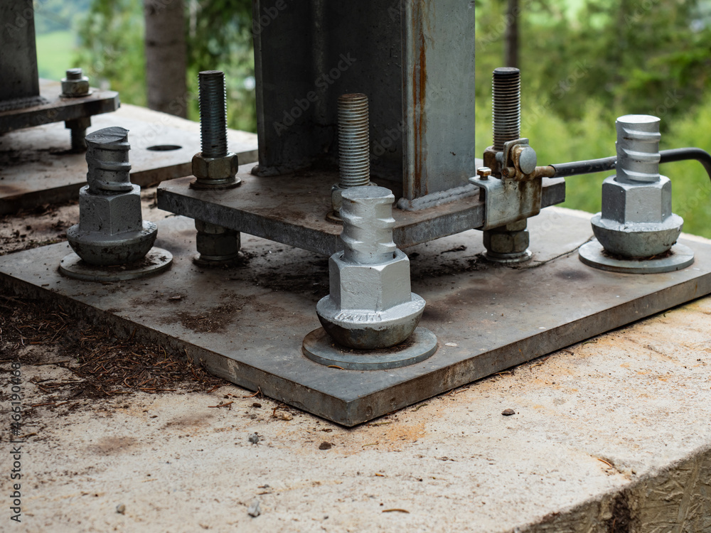 Fototapeta premium Steel plate based on anchor bolts on the concrete pillar