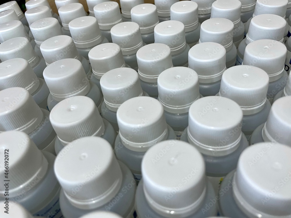 picture full of white plastic caps with their cans, sorted. close up. and different views picture full of white plastic caps with their cans, sorted. close up. and different views