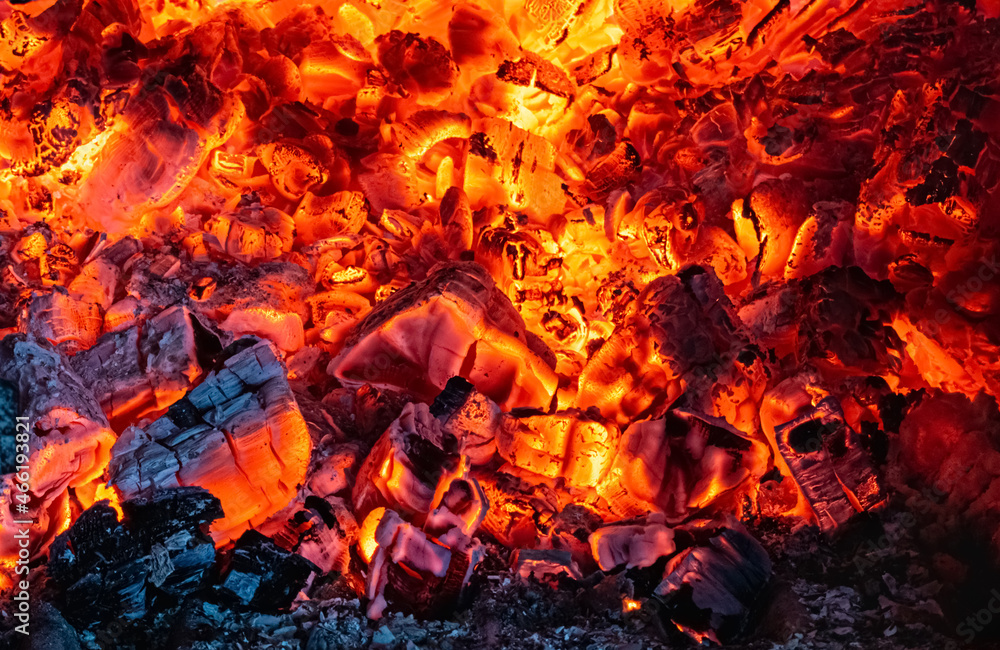 Smoldering embers and ash after burning wood. Abstract background Smoldering embers and ash after burning wood. Abstract background