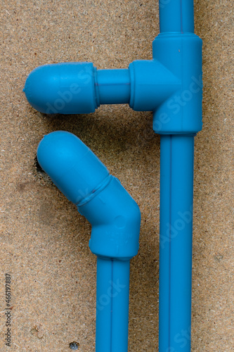 Blue water pipes with fittings, elbows and t