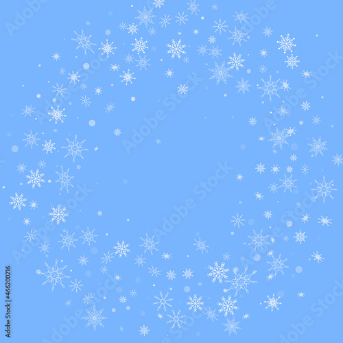 White delicate openwork snowflakes are scattered on a blue background. Festive background  postcard design  wallpaper