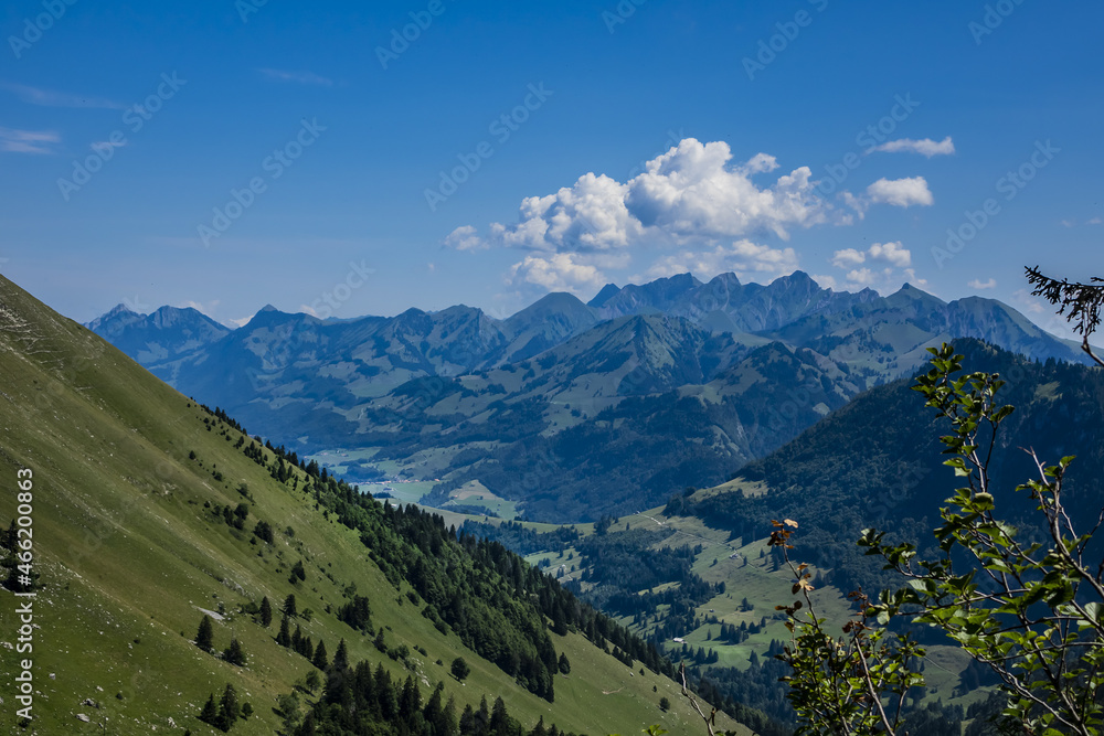Fototapeta premium Picturesque views of the Alps from the pass Col de Jaman. The Col de Jaman (1,512 m) -a mountain pass in the western Swiss Alps. Canton of Vaud, Switzerland.