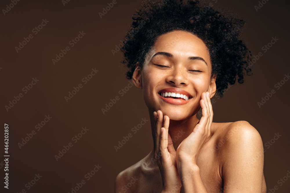 Portrait of beautiful woman with pretty face posing fashionably with her hands. Beauty fashion model woman face with perfect skin and nude makeup. Woman appearance concept. Stock photo Portrait of beautiful woman with pretty face posing fashionably with her hands. Beauty fashion model woman face with perfect skin and nude makeup. Woman appearance concept. Stock photo