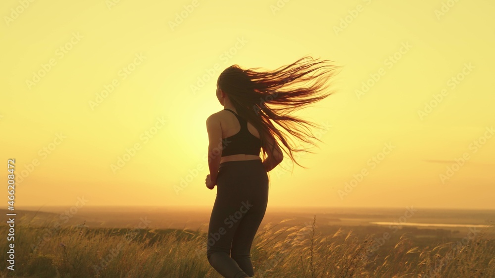 Fotka „girl jogging at sunset sky, active lifestyle rays sun, cardio