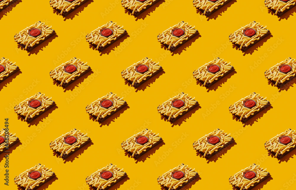 Pattern of french fries on yellow pastel background Pattern of french fries on yellow pastel background