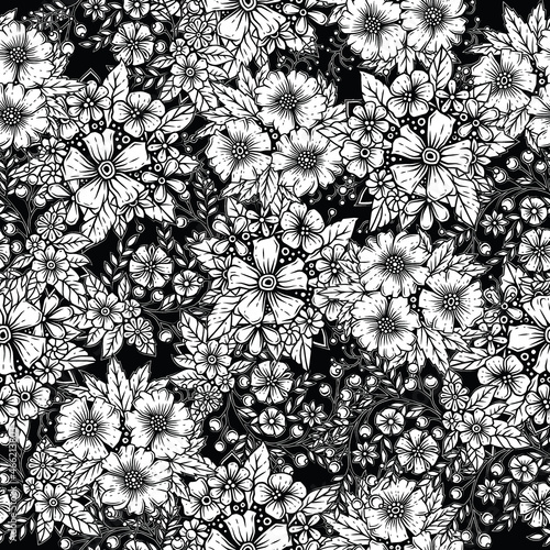 Original vector seamless pattern in vintage style. White flowers with a black outline on a black background. A design element.