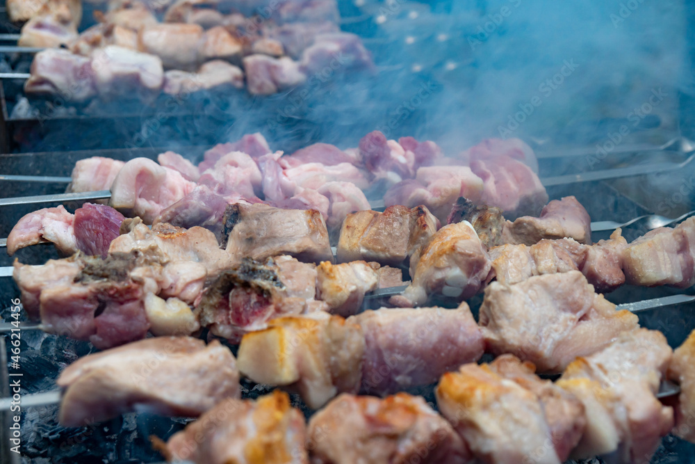 Georgian mtsvadi (Shashlik) preparation. Smoking shashlik on the grill Georgian mtsvadi (Shashlik) preparation. Smoking shashlik on the grill
