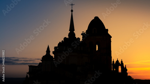 Beautiful sunset. Aerial of Catholic church in Spanish town of Jerez Caballeros © REC Stock Footage