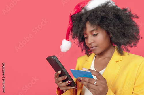 female young adult shopping by phone with the help of a cash card
