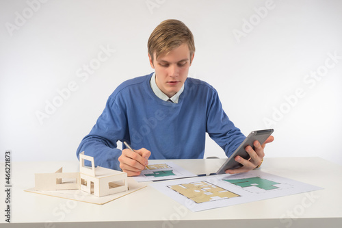 Young architect works with ...