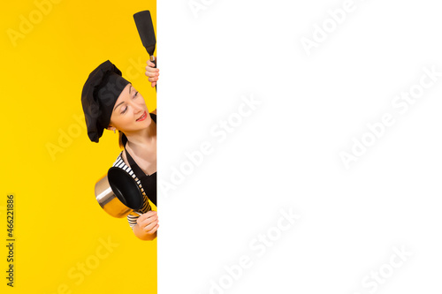 Woman chef with white banne...