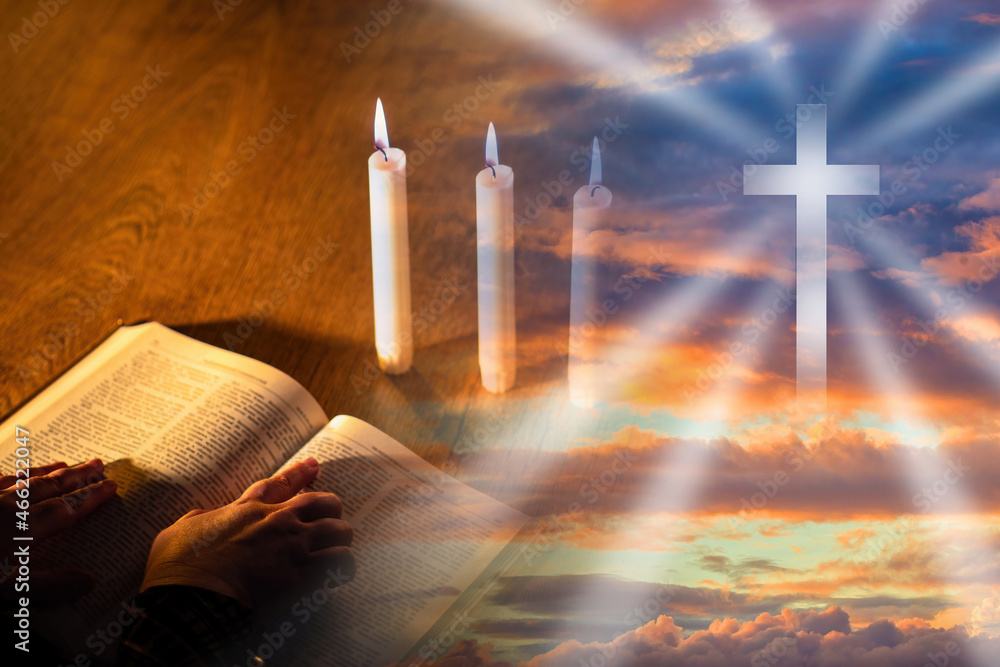 Silhouette holy cross. Praying hands on bible. holy cross as a symbol