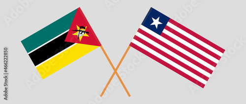 Crossed flags of Mozambique and Liberia. Official colors. Correct proportion