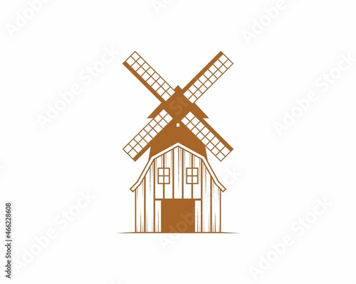 Barn farm with windmill behind