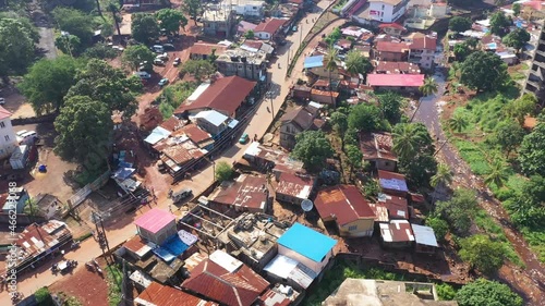 Aerial Freetown Sierra Leone residentail poor neighborhood. Coast of west Africa suffers extreme poverty and hunger. Congested crowded homes and businesses. Tropical climate. Transportation bad roads. photo