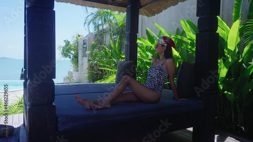 Cute Asian Girl In Swimming Suit Sitting Alone In Resort On Sunny Day SlowMotion