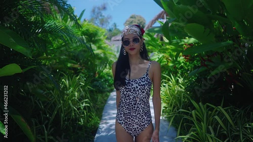 Asian Girl In Swimming Suit Walking Alone In Resort On Sunny Day in Slow Motion