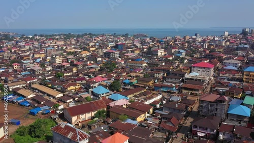 Aerial Freetown city congested building traffic part 2. Coast of west Africa suffers extreme poverty and hunger. Congested crowded homes and businesses. Tropical climate. Transportation bad roads. photo