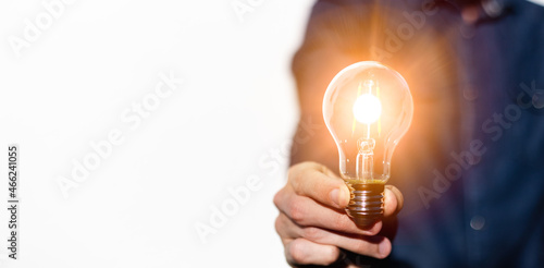 hand holding light bulb. idea concept with innovation and inspiration