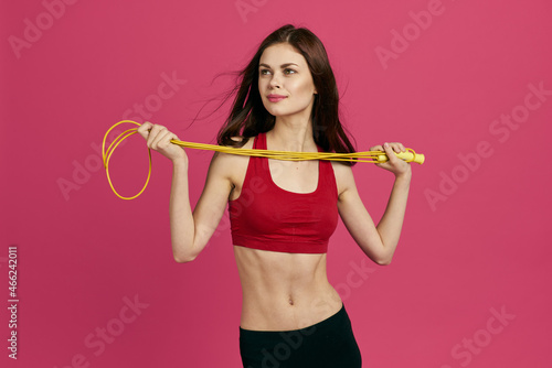 pretty woman workout exercise gym pink background © VICHIZH