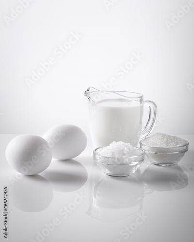 milk, salt, sugar, egg on a white background