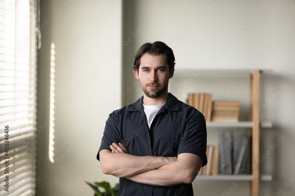 Portrait of happy young handsome successful confident man worker employee boss looking at camera, feeling satisfied with professional corporate career, joyful male homeowner posing in living room. Portrait of happy young handsome successful confident man worker employee boss looking at camera, feeling satisfied with professional corporate career, joyful male homeowner posing in living room.
