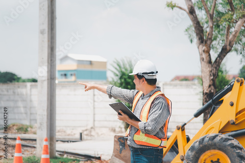 Man construction engineer at construction site © pongmoji