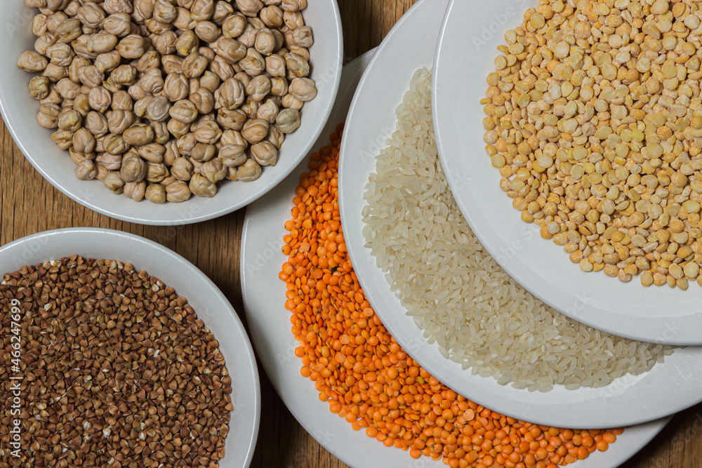 Various cereals on a wooden background. The concept of wholesome food. Vegetarian food Various cereals on a wooden background. The concept of wholesome food. Vegetarian food