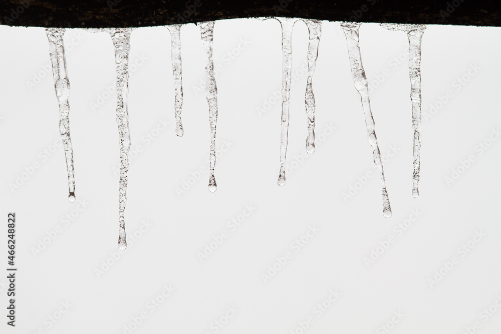 a lot of icicles hanging from the roof a lot of icicles hanging from the roof
