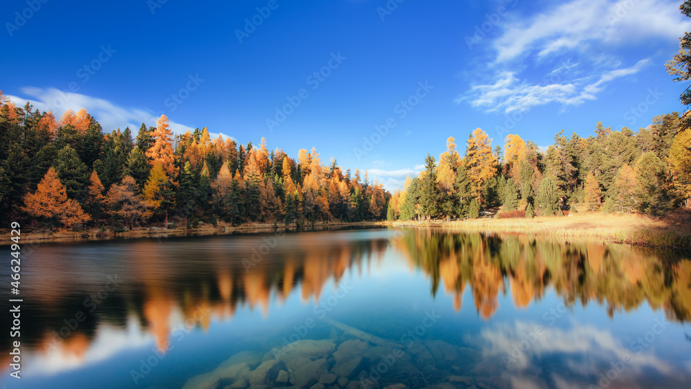 Autumn landscape with fantastic colors of plains reflected in an alpine lake Autumn landscape with fantastic colors of plains reflected in an alpine lake