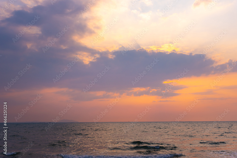 Summer beach with blue sea water and purple sky in twilight period, Sunrise or Sunset over the sea with vintage retro tone.