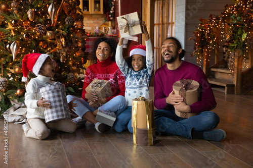 Overjoyed African American family with kids unpacking Christmas gifts Stock  Photo - Alamy