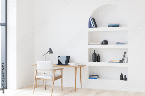 Workplace interior with table and laptop on parquet floor. Mockup