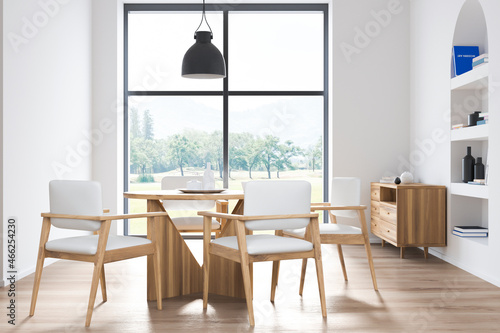 White dining room with arched shelf