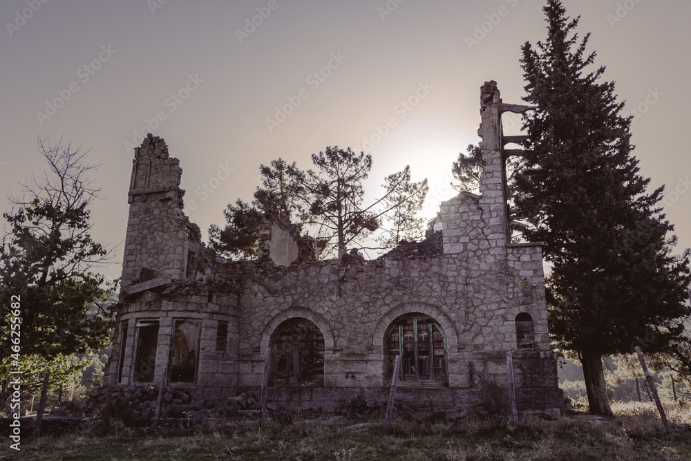 Fototapeta premium Abandoned and demolished old stone building. Selective focus. Copy space.