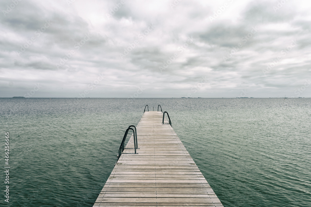 Wooden pier leading to the sea. Baltic Sea, Copenhagen. Denmark. Freedom. Trips