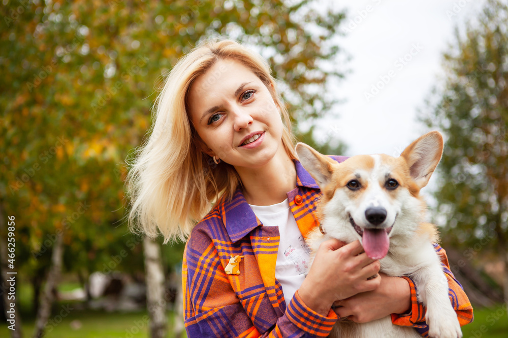 Portrait of a woman with a dog corgi breed. Portrait of a woman with a dog corgi breed.