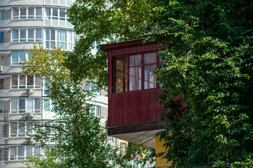 old small house on the background of a new building