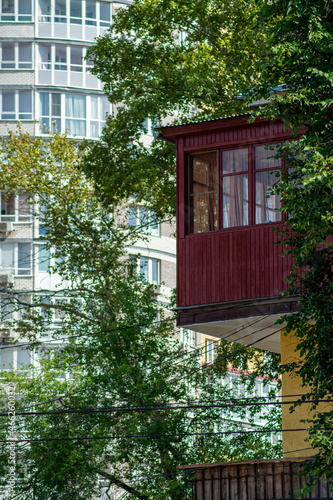 old small house on the background of a new building