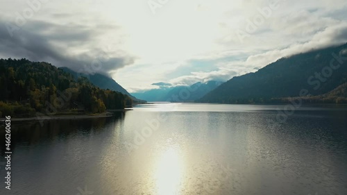 Lake at sunset. Autumn yellow trees. the mountains. Aerial top view. Teletskoye lake Altai. High quality 4k footage