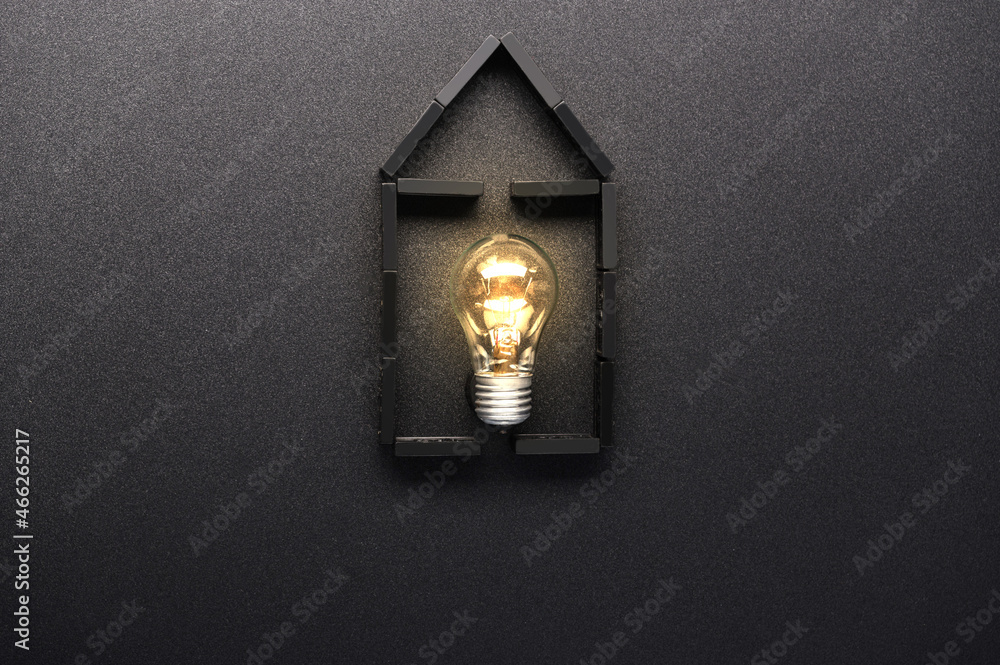 House and glowing lamp. Light in the house. Home electricity. House and glowing lamp. Light in the house. Home electricity.