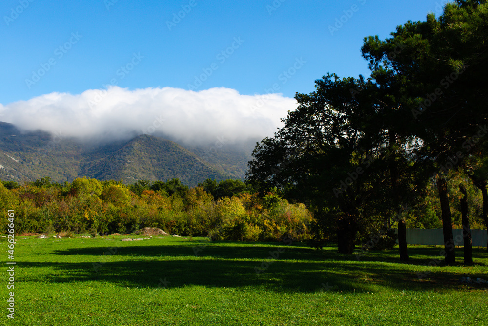Fototapeta premium A big white cloud hangs on the mountain