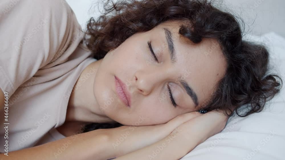 Portrait of attractive girl sleeping on comfy pillow in bed relaxing at home alone in leisure time. Lifestyle and modern people concept. Portrait of attractive girl sleeping on comfy pillow in bed relaxing at home alone in leisure time. Lifestyle and modern people concept.