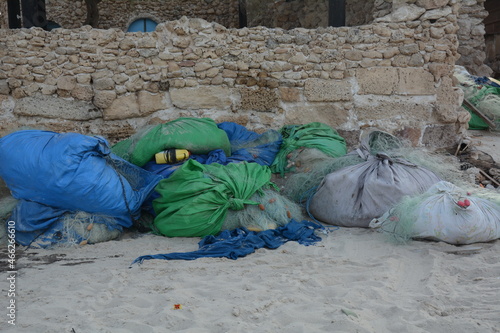 Fishing nets with buoys and ropes. Fishing nets ropes and floats on a harbor photo