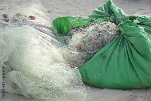 Fishing nets with buoys and ropes. Fishing nets ropes and floats on a harbor photo