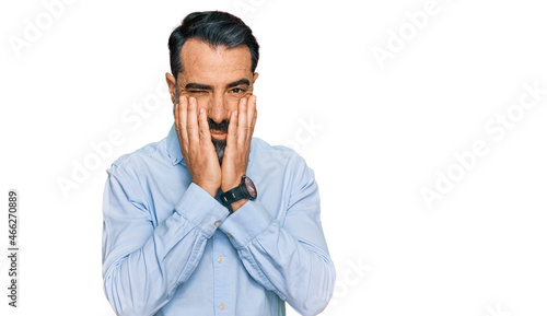 Middle aged man with beard wearing business shirt tired hands covering face, depression and sadness, upset and irritated for problem
